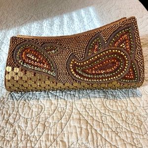 10”W x 4-1/2”H. Snap closure.